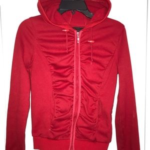 Form fitting, red sweater.